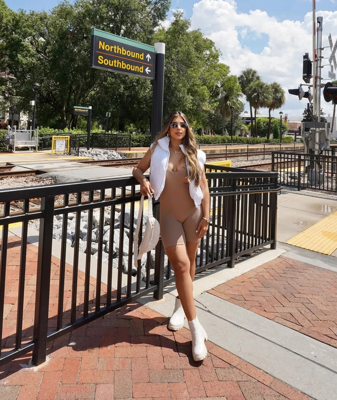 Early fall outfits ideas 2026 Neutral Romper With A White Puffer Vest