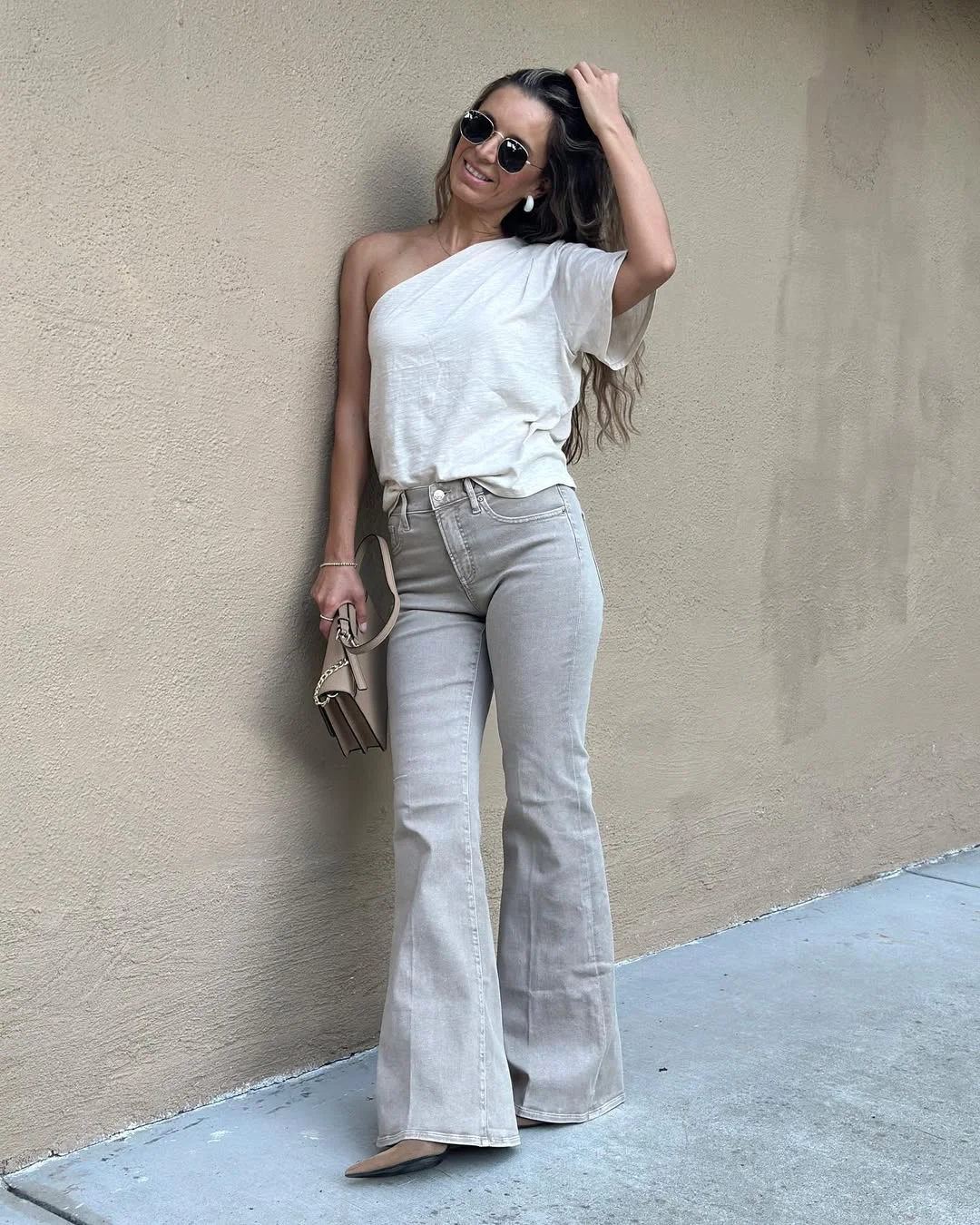 Early summer outfits 2026 One-Shoulder White Tee With Pale Flare Jeans
