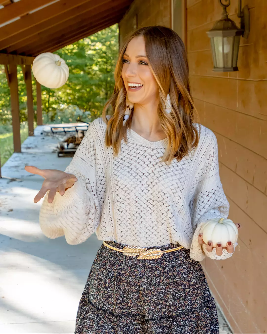 Early summer outfits 2026 Open-Knit Sweater With A Dark Floral Skirt