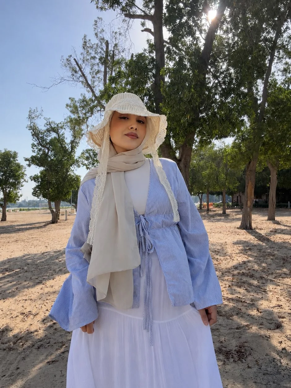 Early summer outfits 2026 Blue Stripes, White Layers, And Soft Beachside Modesty