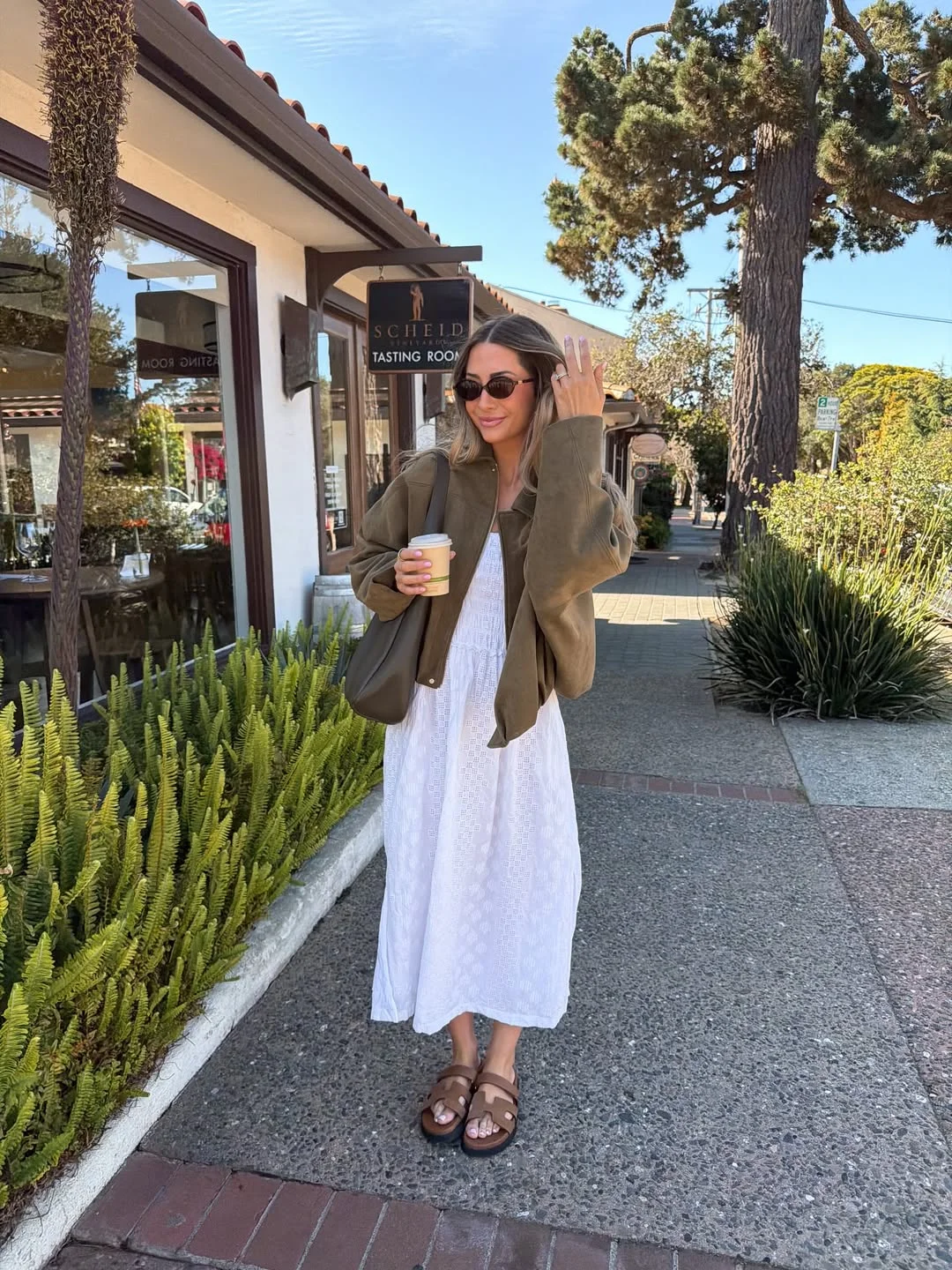 Early summer outfits 2026 White Eyelet Dress With An Olive Jacket