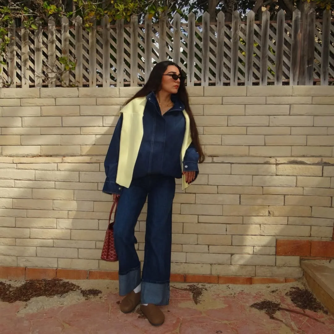 fall denim outfits for women 2026 Dark Denim Set With A Cream Sweater Tossed Over