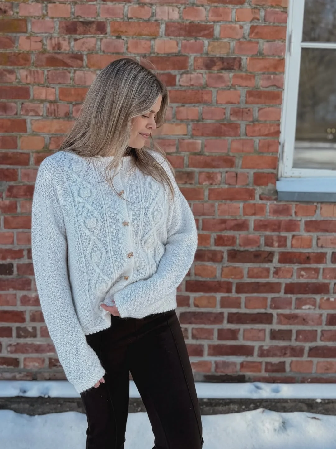 fall fashion for women over 40 A Cream Cable Knit That Lets Texture Lead