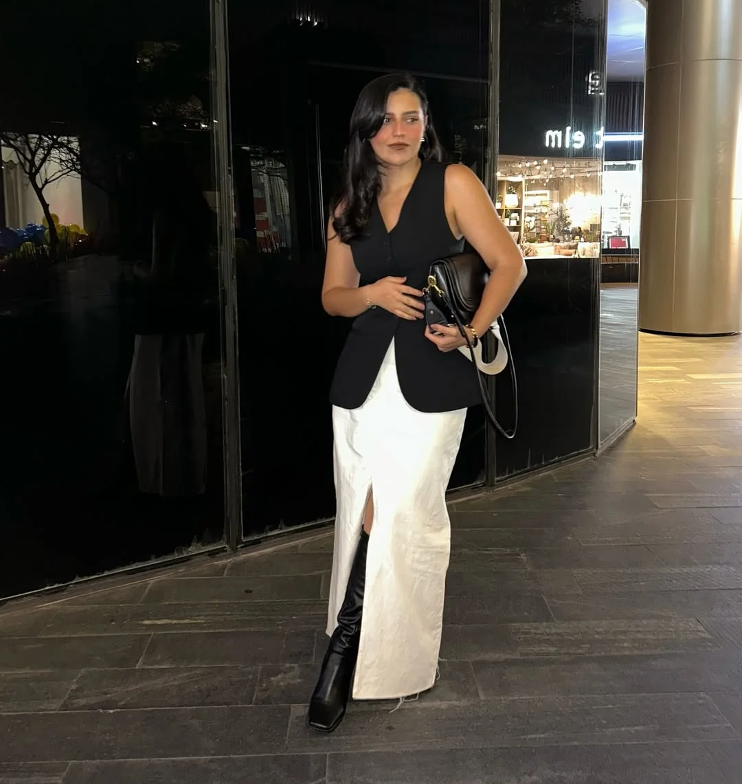 fall fashion outfits 2026 Black Vest With a White Satin Maxi Skirt