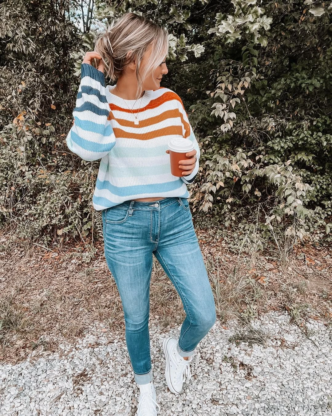 fall mom outfits 2026 A Colorful Striped Sweater With Classic Jeans