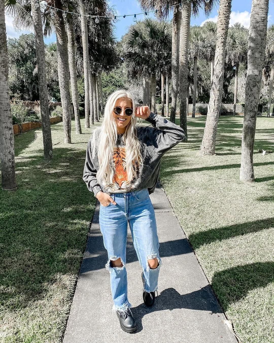 fall mom outfits 2026 A Graphic Sweatshirt and Ripped Jeans With Weekend Energy