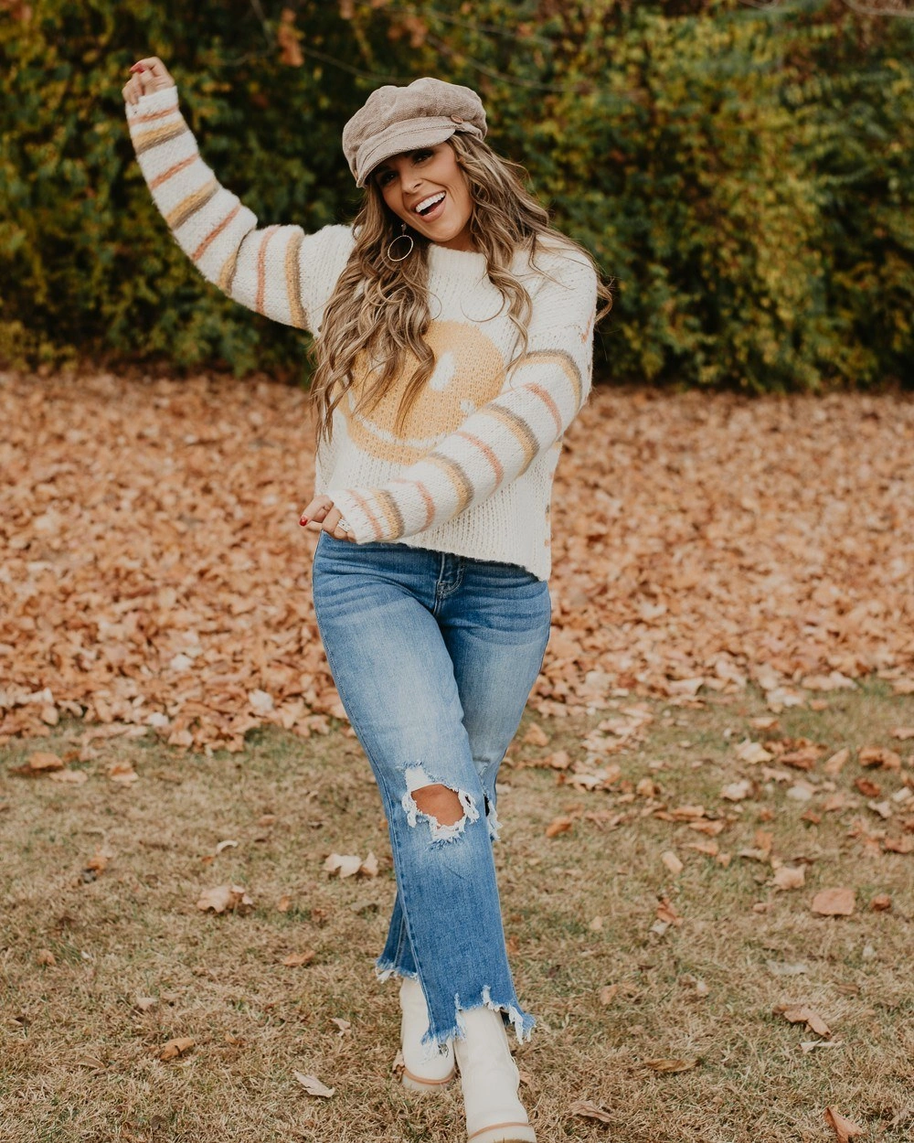 fall mom outfits 2026 A Cozy Striped Sweater With Flared Denim