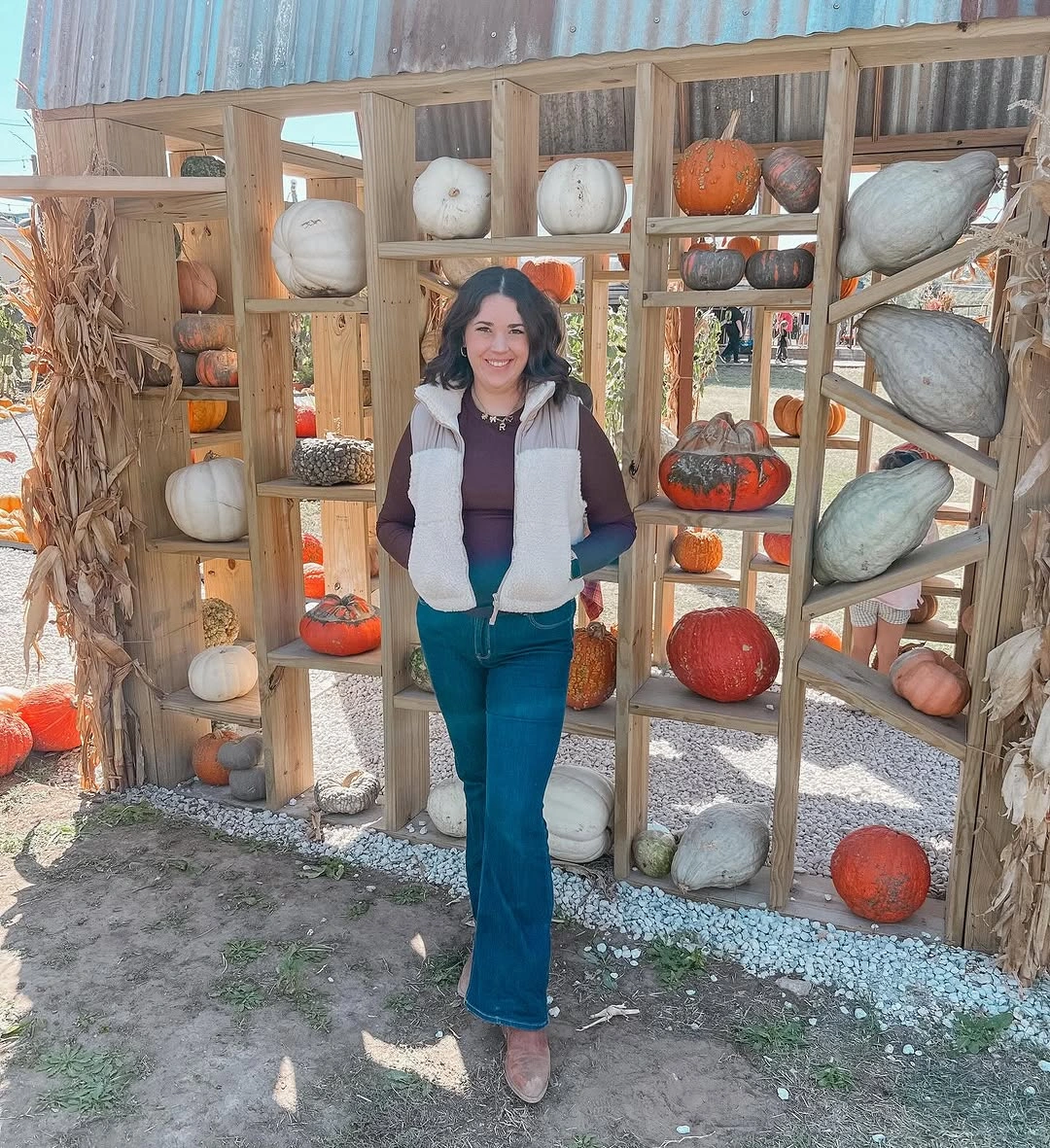 fall mom outfits 2026 A Fleece Vest and Flare Jeans for the Pumpkin Patch
