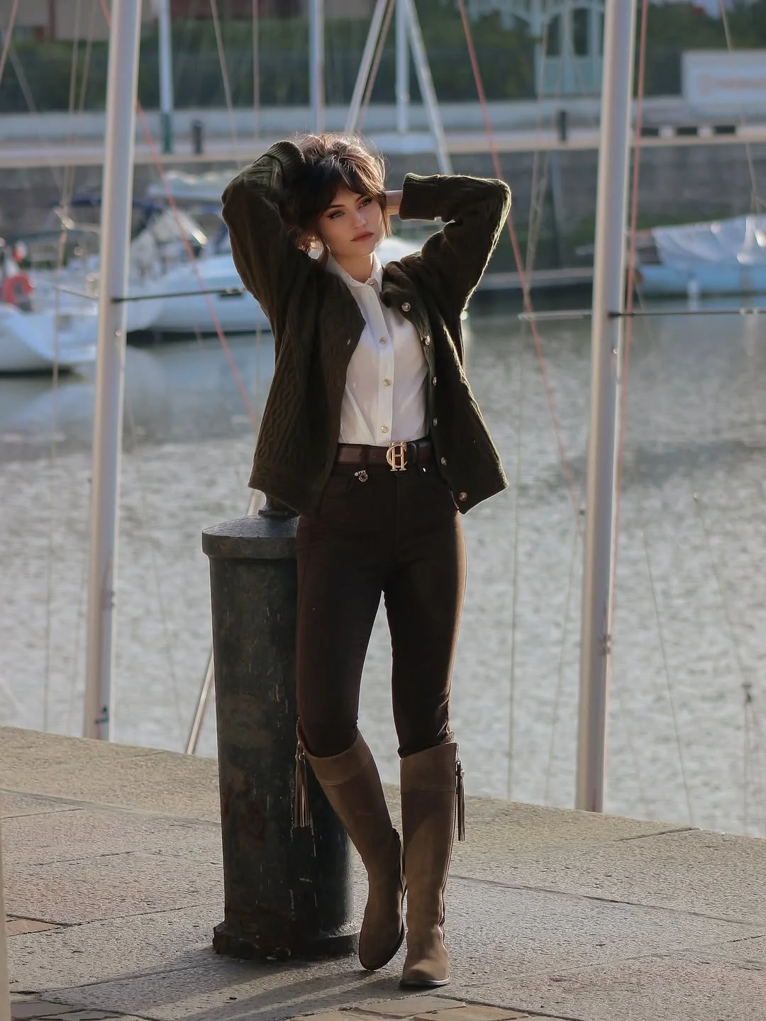 fall outfits for women in 30s style 2026 - Dark Trousers and Tall Boots for a Smart Waterfront Fall Outfit