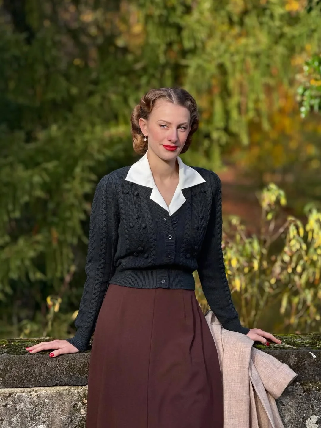 fall outfits for women in 30s style 2026 - A Black Cable-Knit Cardigan with Deep Brown Tailoring