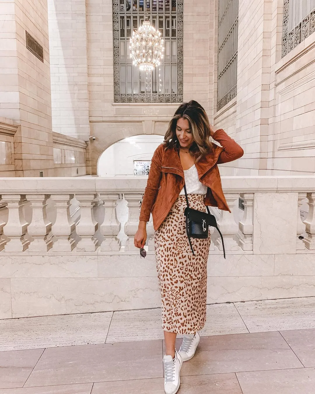Early summer outfits 2026 Leopard Midi Skirt With Rust Suede And Sneakers