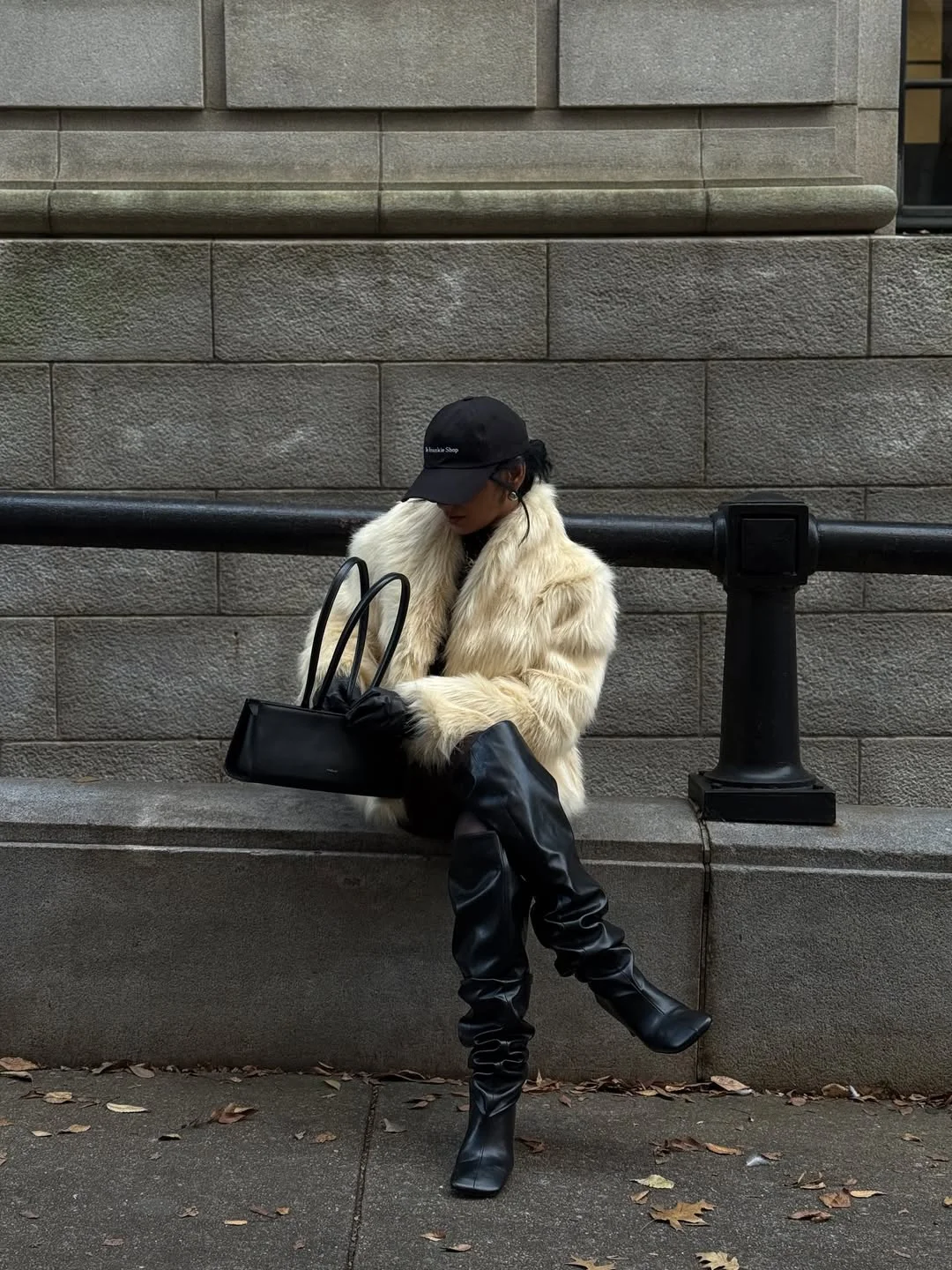 Early summer outfits 2026 Cream Faux Fur And Black Boots For A Dramatic Cool Night