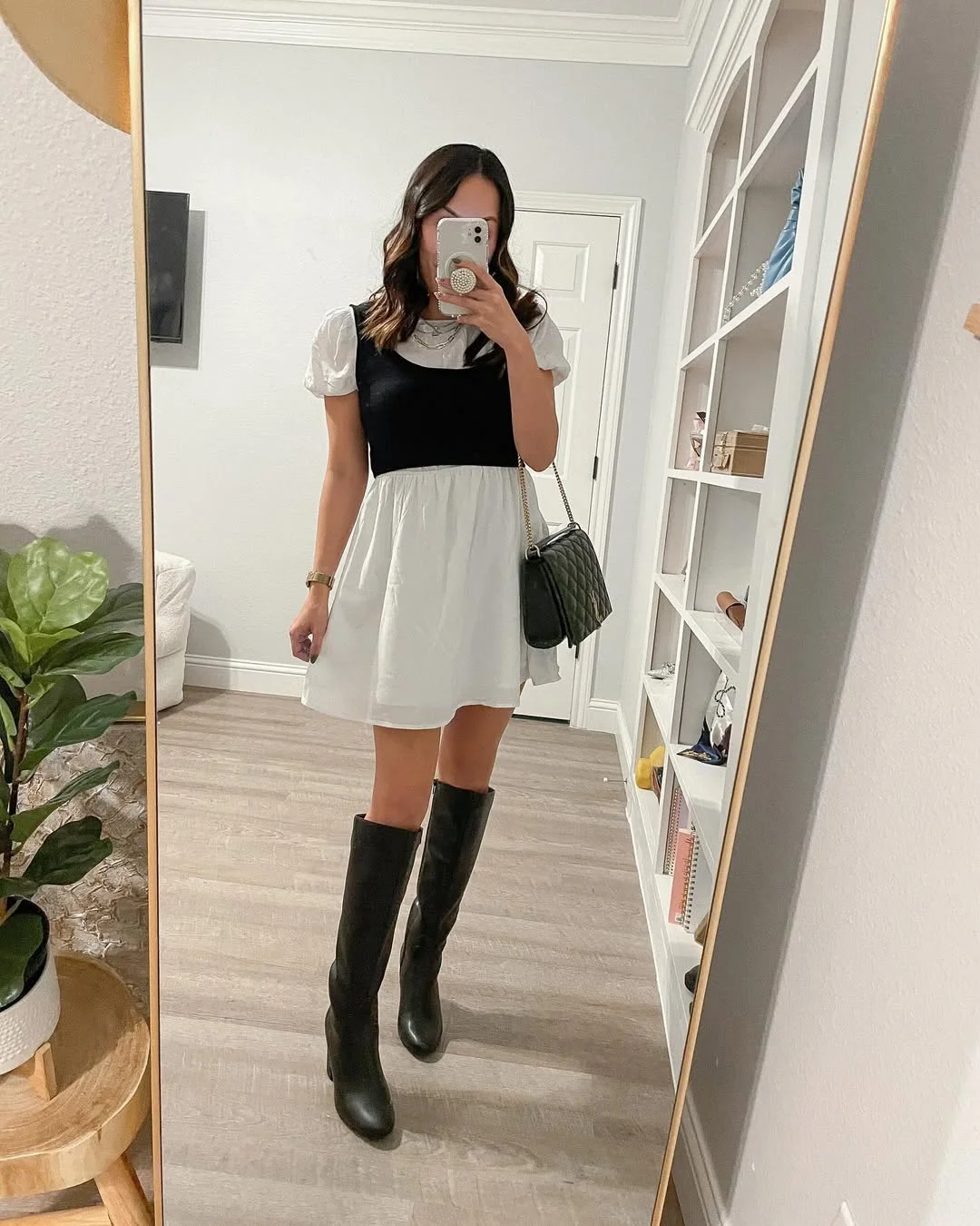 Early summer outfits 2026 Black And White Mini Dress With Playful Boots