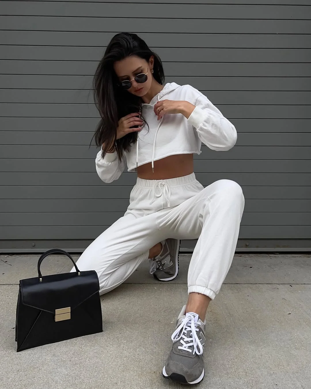 Early summer outfits 2026 White Athleisure With A Sharp Black Bag