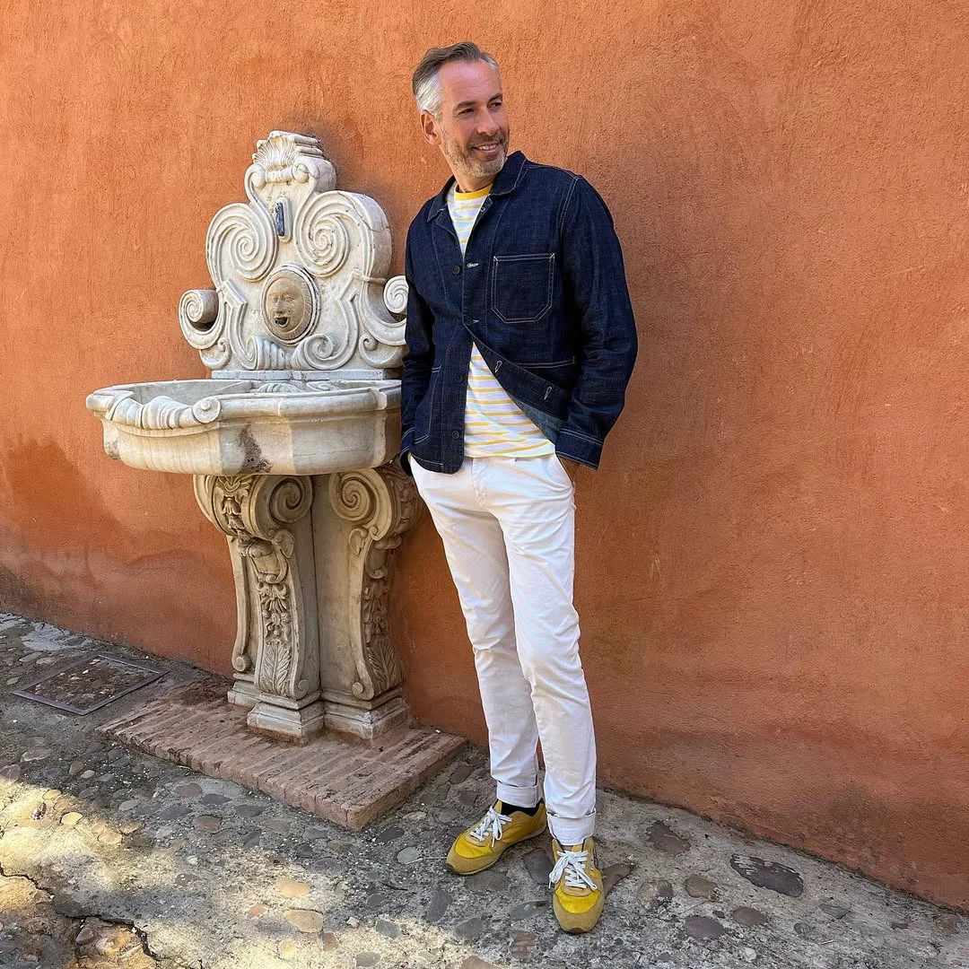 Fall outfits ideas for men 2026 Dark Denim Jacket and White Trousers With Mature Ease