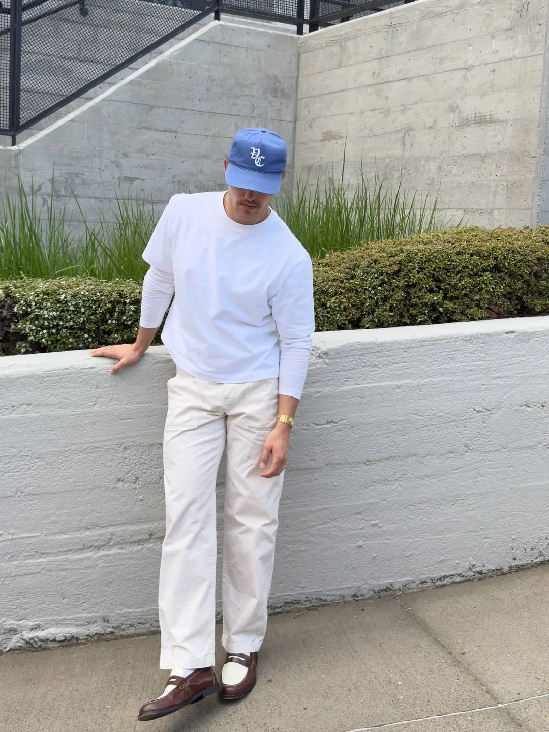 Fall outfits ideas for men 2026 Clean White Layers With Loafers and a Blue Cap