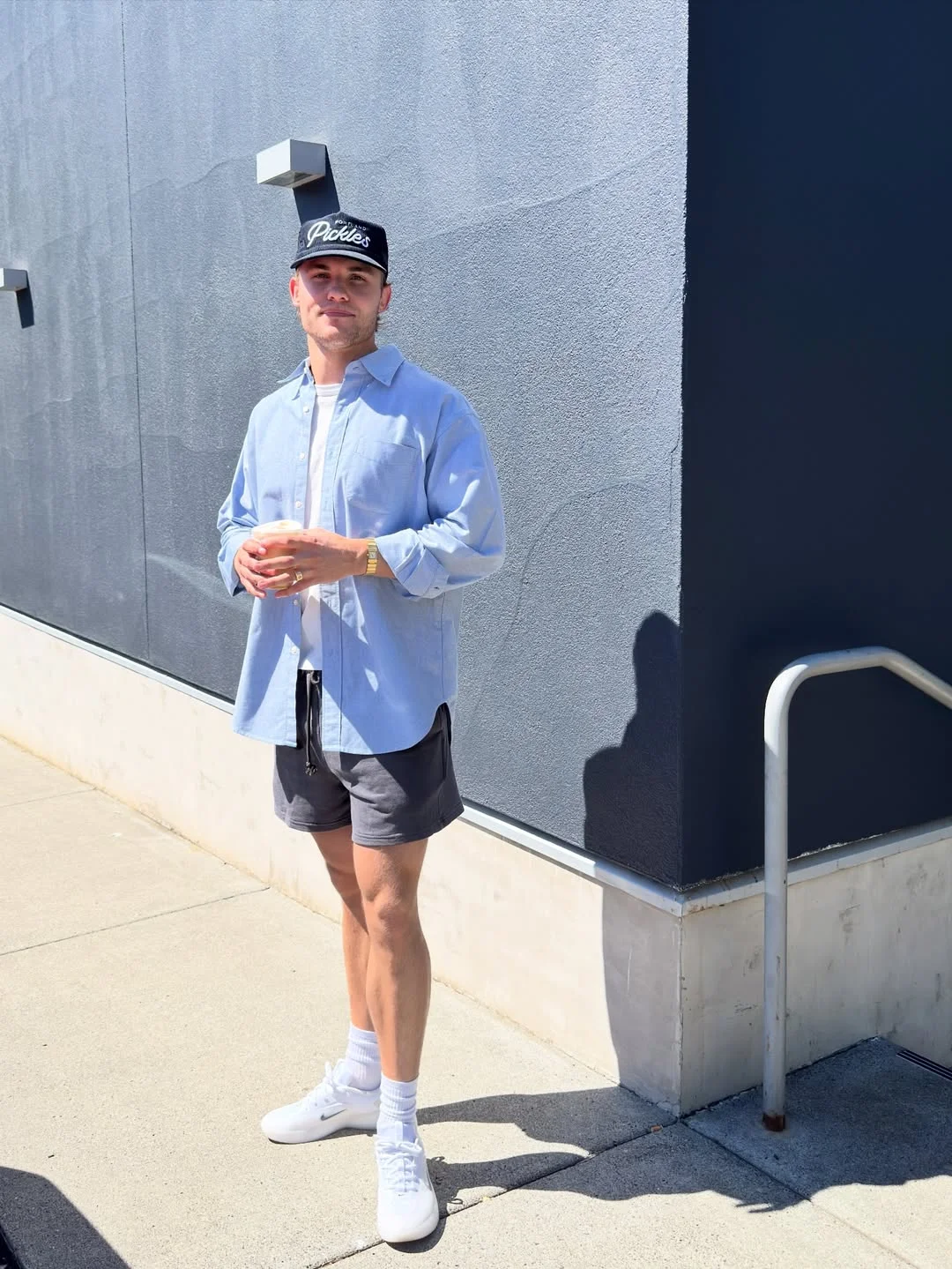 Fall outfits ideas for men 2026 Light Blue Shirt With Shorts for Warm Fall Days