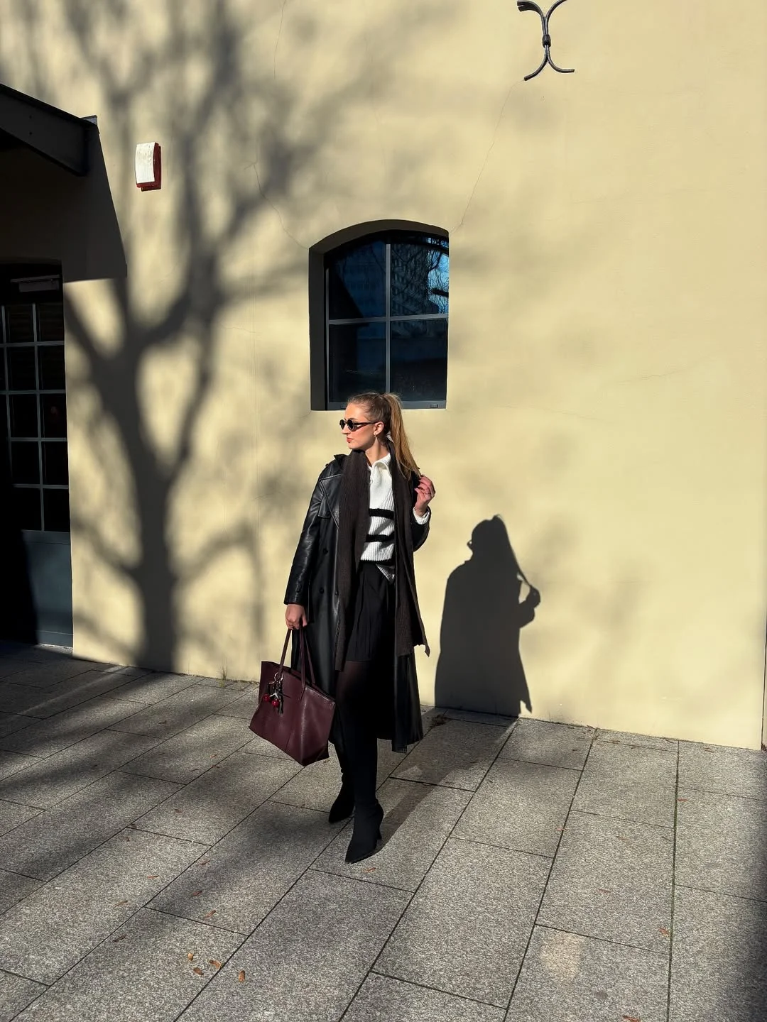 fall outfits with boots 2026 Black Leather Coat, Mini Skirt And Sleek Tall Boots