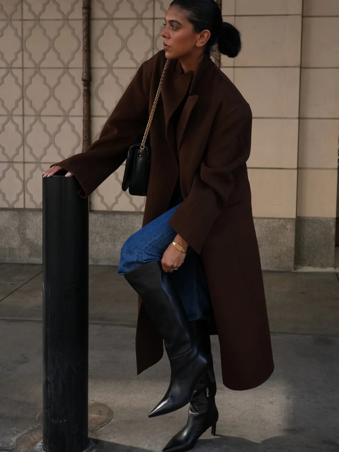 fall outfits with boots 2026 Chocolate Coat, Blue Jeans And Sharp Black Boots