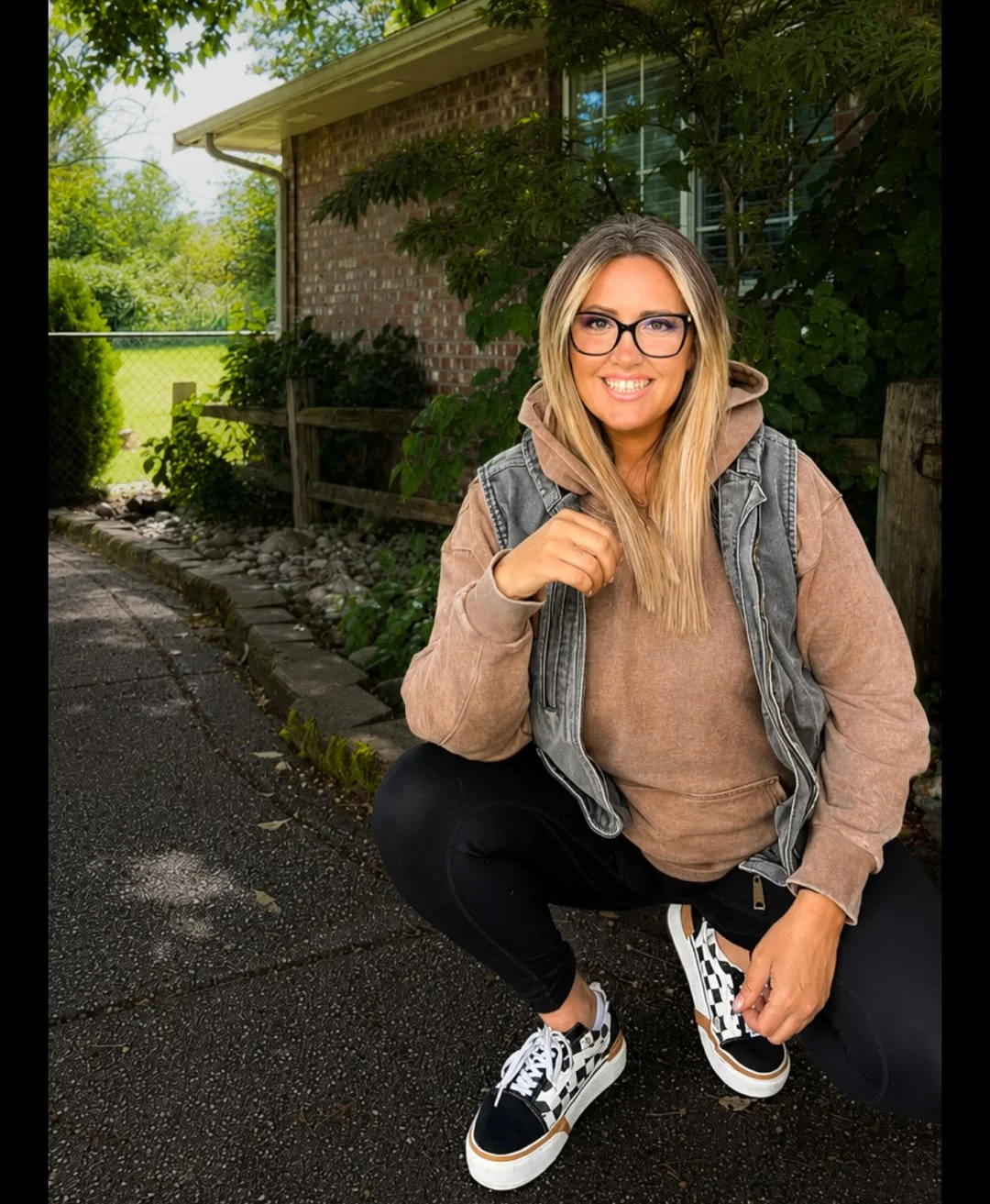 fall outfits with leggings and sneakers 2026 Denim Vest Over A Taupe Hoodie With Black Leggings