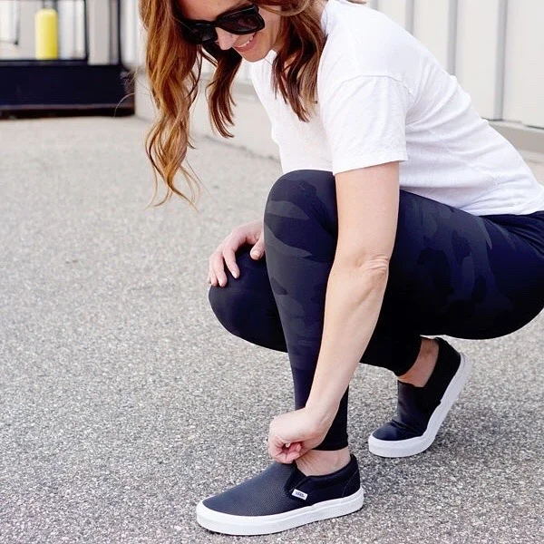 fall outfits with leggings and sneakers 2026 Black Camo Leggings With A White Tee And Slip-On Sneakers