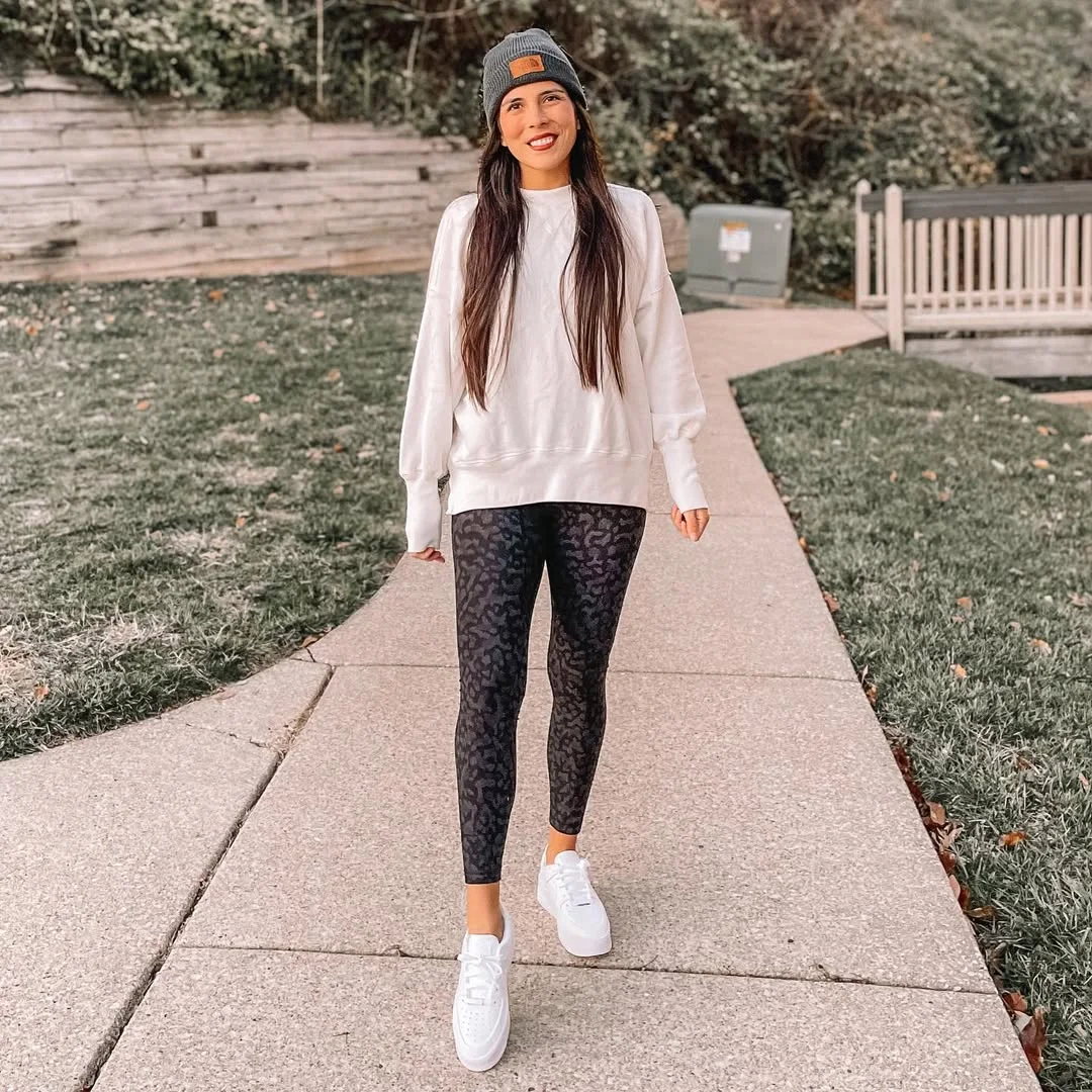 fall outfits with leggings and sneakers 2026 White Sweatshirt And Black Leopard Leggings For Easy Weekends