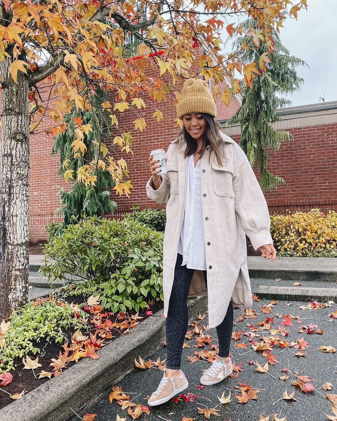 fall outfits with leggings and sneakers 2026 Oatmeal Coat With Black Leggings For Leafy Coffee Walks