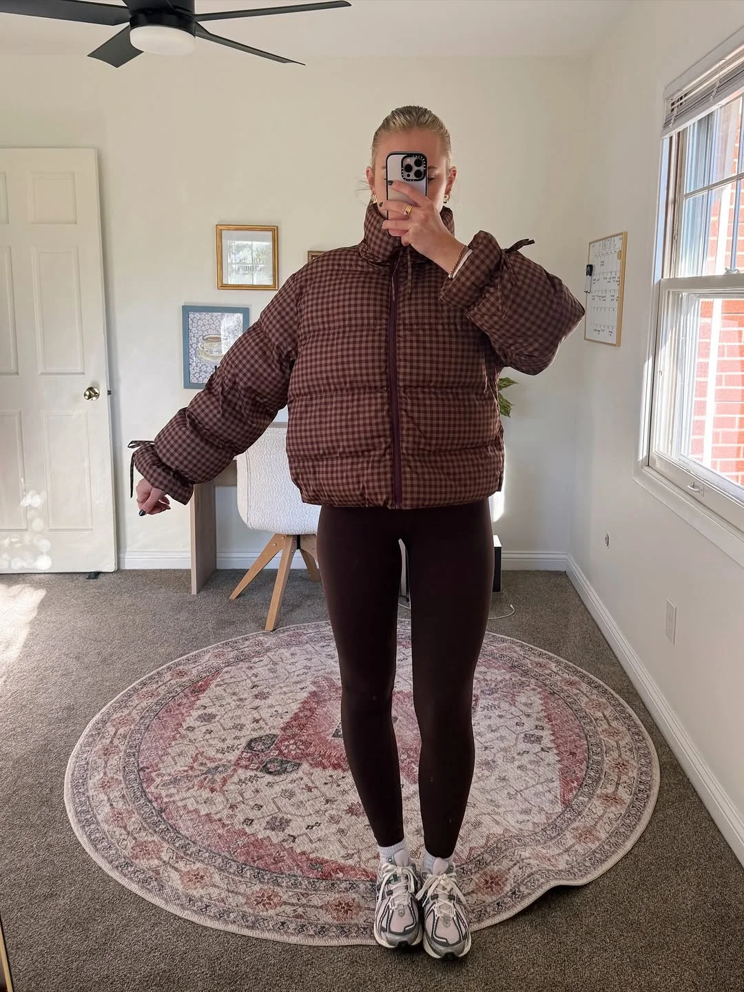 fall outfits with leggings and sneakers 2026 Brown Check Puffer With Dark Leggings And Chunky Sneakers