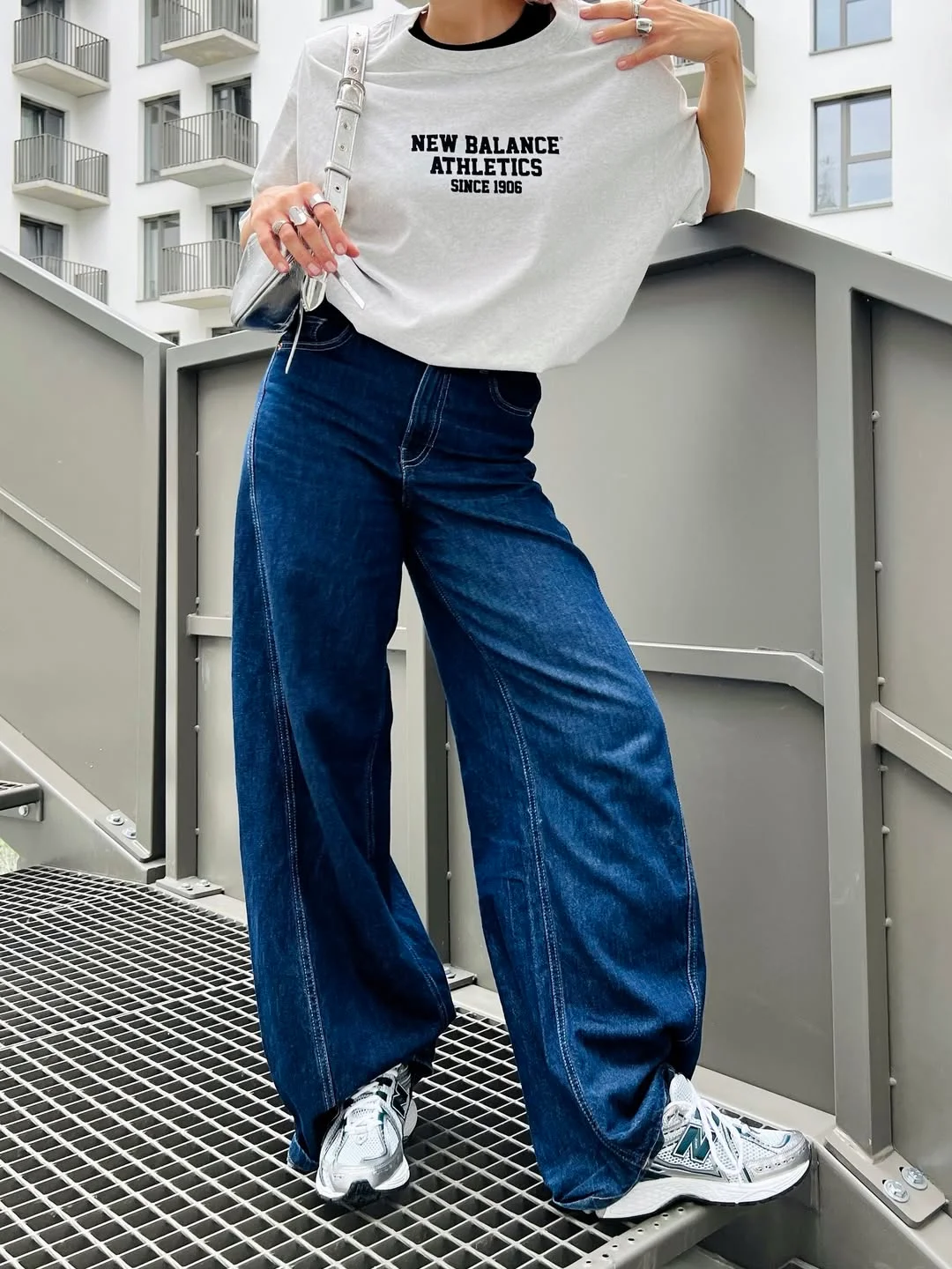 fall outfits with sneakers and jeans 2026 + Dark Wide-Leg Jeans With Retro Silver Sneakers