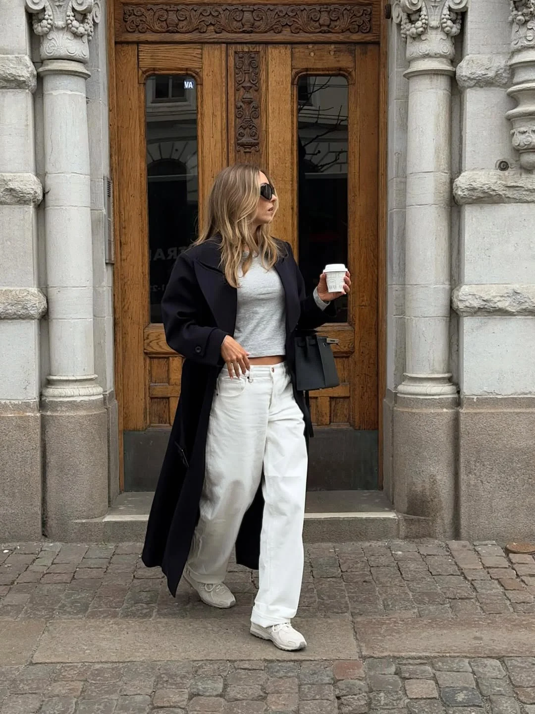 fall outfits with sneakers and jeans 2026 + White Wide-Leg Jeans With a Long Black Coat
