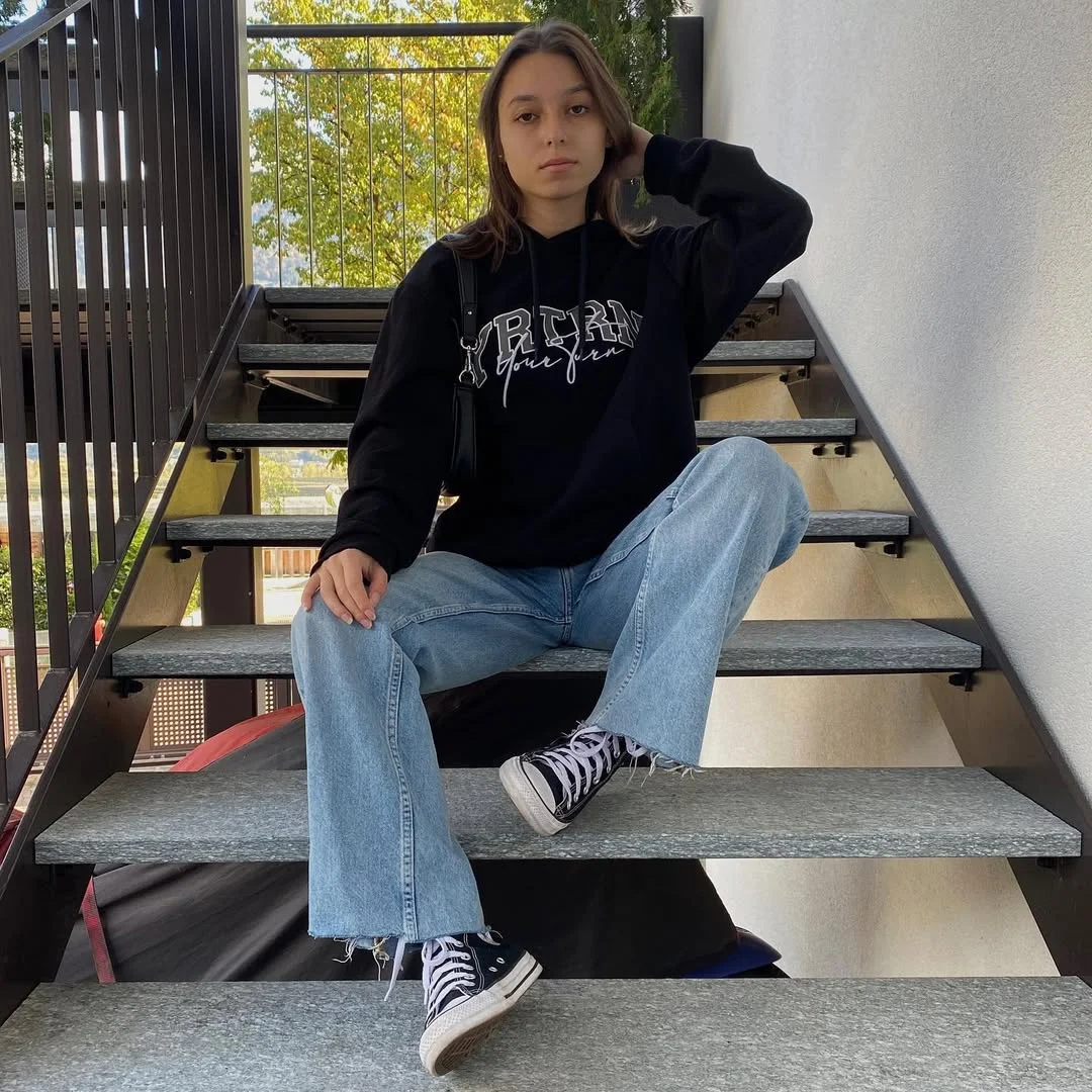 fall outfits with sneakers and jeans 2026 + Black Hoodie With Light Flare Jeans and High-Top Sneakers