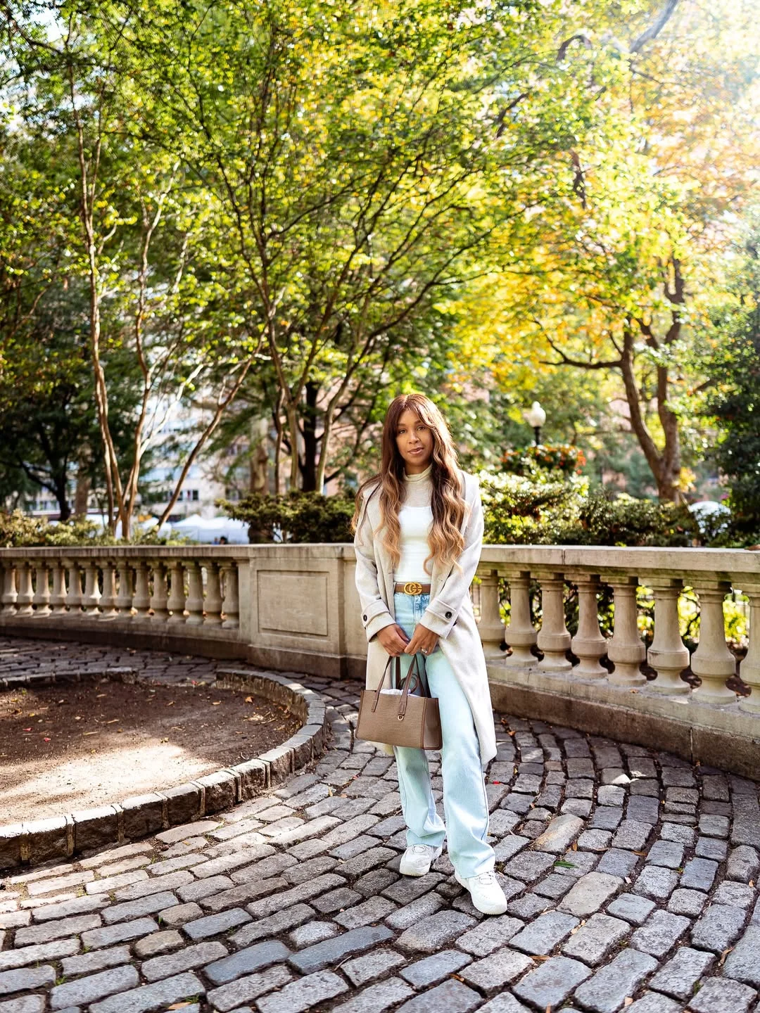 fall outfits with sneakers and jeans 2026 + Light Trench Coat With Pale Denim and White Sneakers