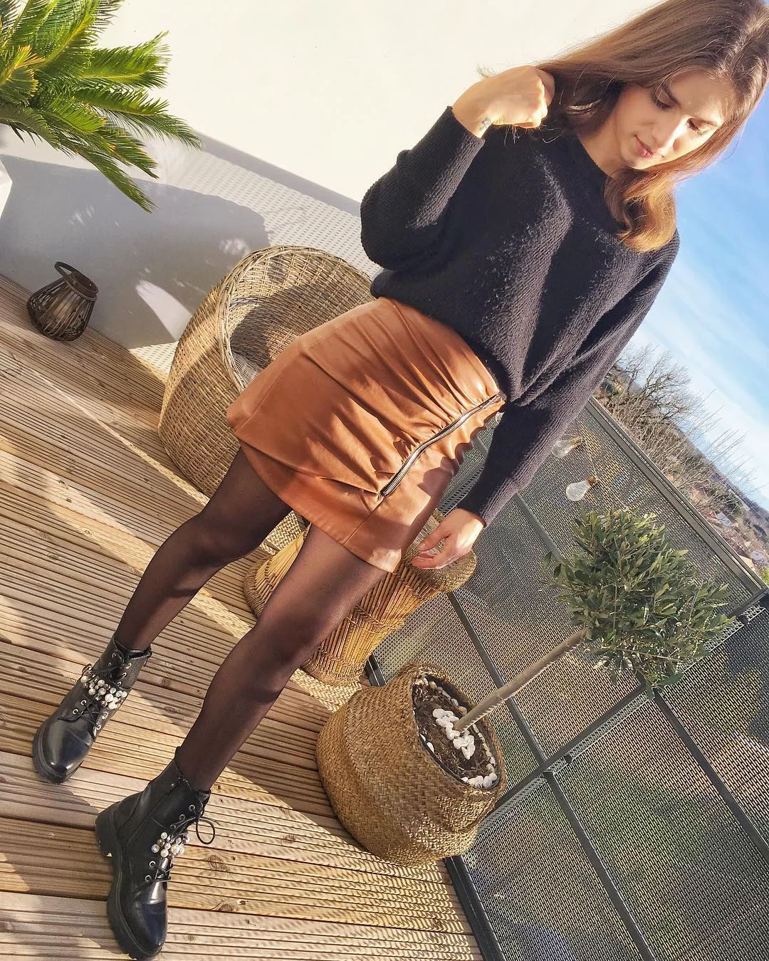 fall outfits with tights and skirt 2026 + Cognac Leather Mini with a Black Knit and Combat Boots