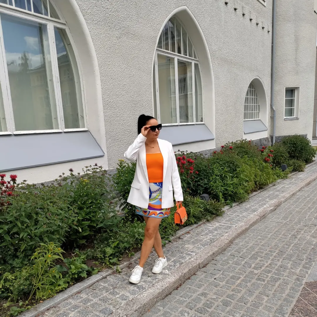 fall skirt and sneakers outfits 2026 + Colorful Mini Skirt With A White Blazer And Clean Sneakers