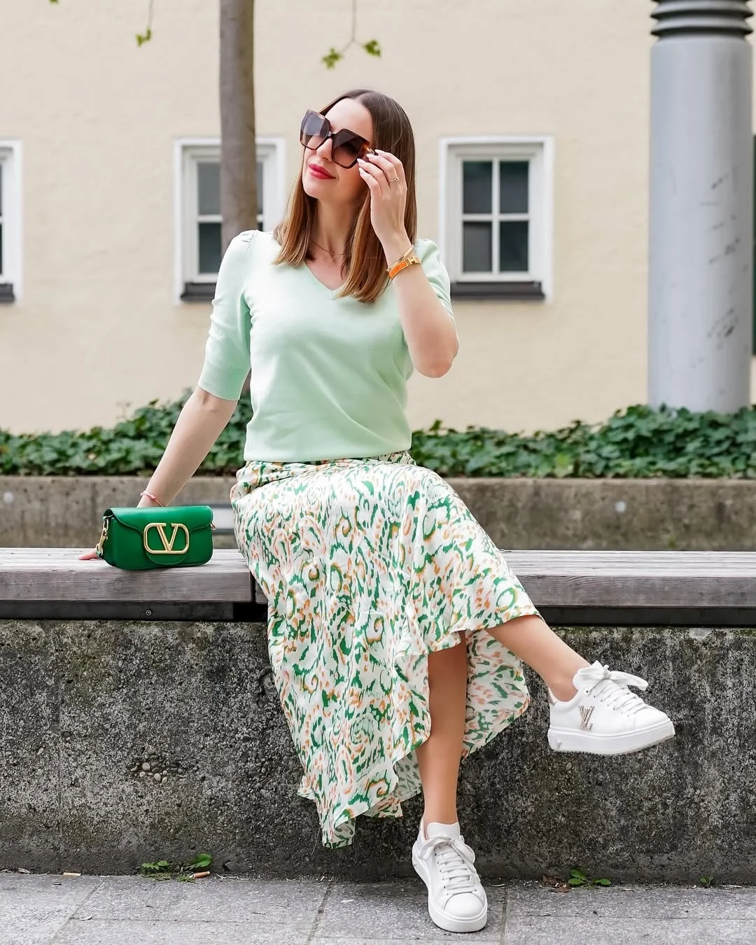 fall skirt and sneakers outfits 2026 + Mint Knit With A Green Printed Midi Skirt And White Sneakers