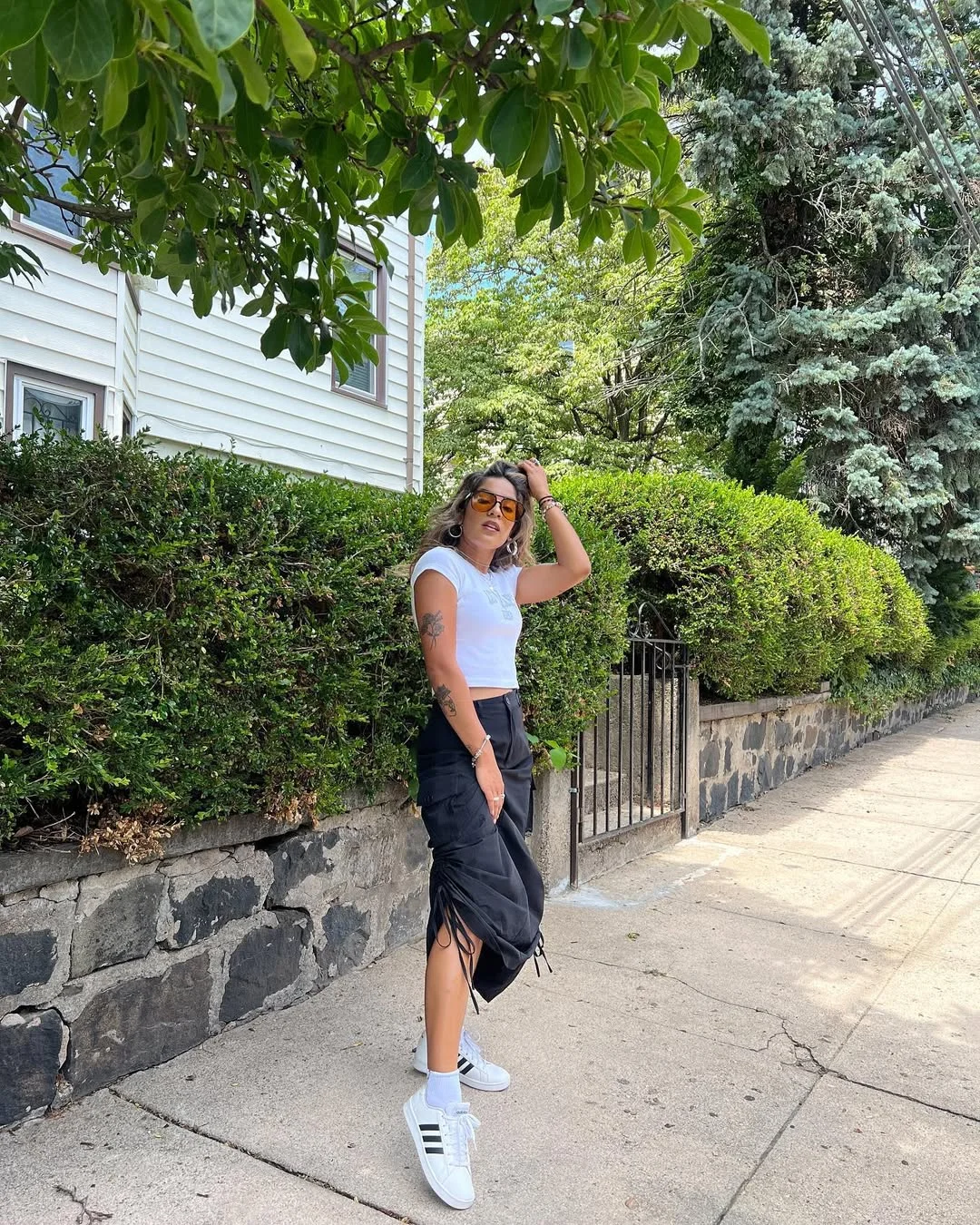 fall skirt and sneakers outfits 2026 + Ruched Black Skirt With A Cropped Tee And Clean White Sneakers