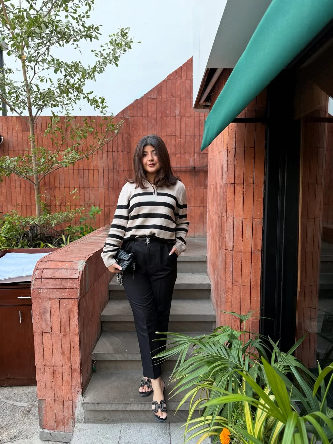 fall smart casual work outfit for women 2026 Striped Half-Zip Sweater With Black Cropped Trousers