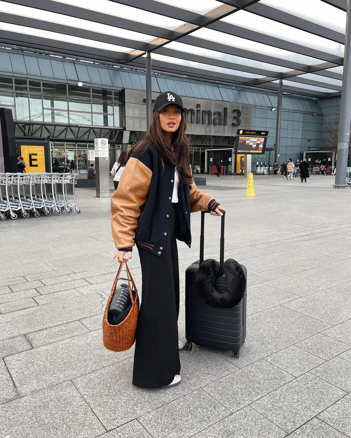 fall travel outfits 2026 + Varsity Jacket Energy for the Airport