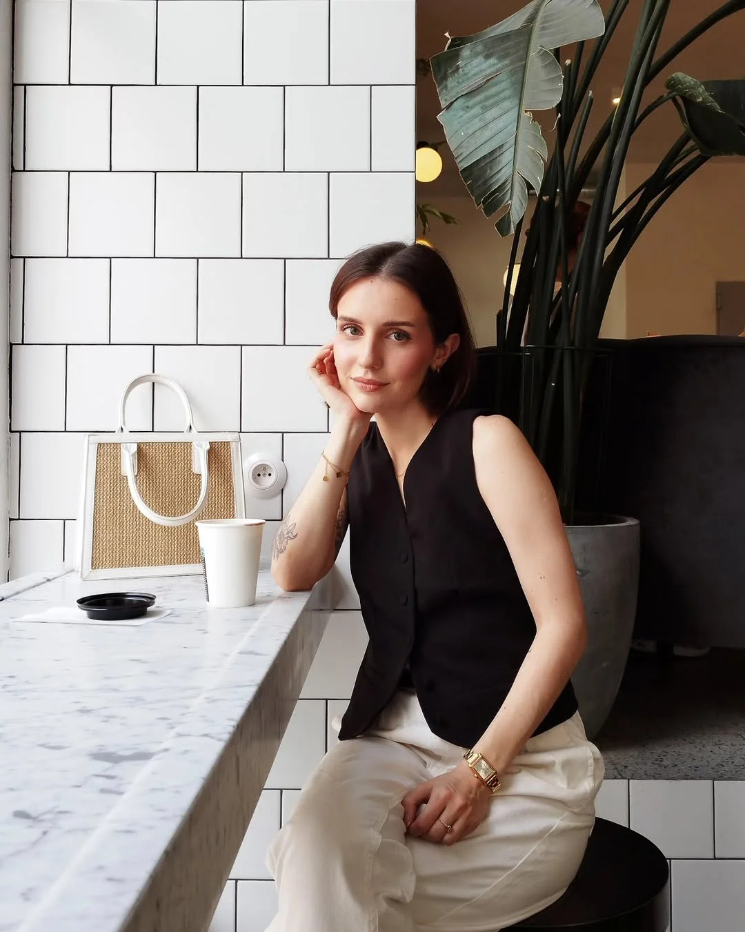 fall vest outfits for women 2026 Black Vest With Cream Trousers for Minimalist Fall Dressing
