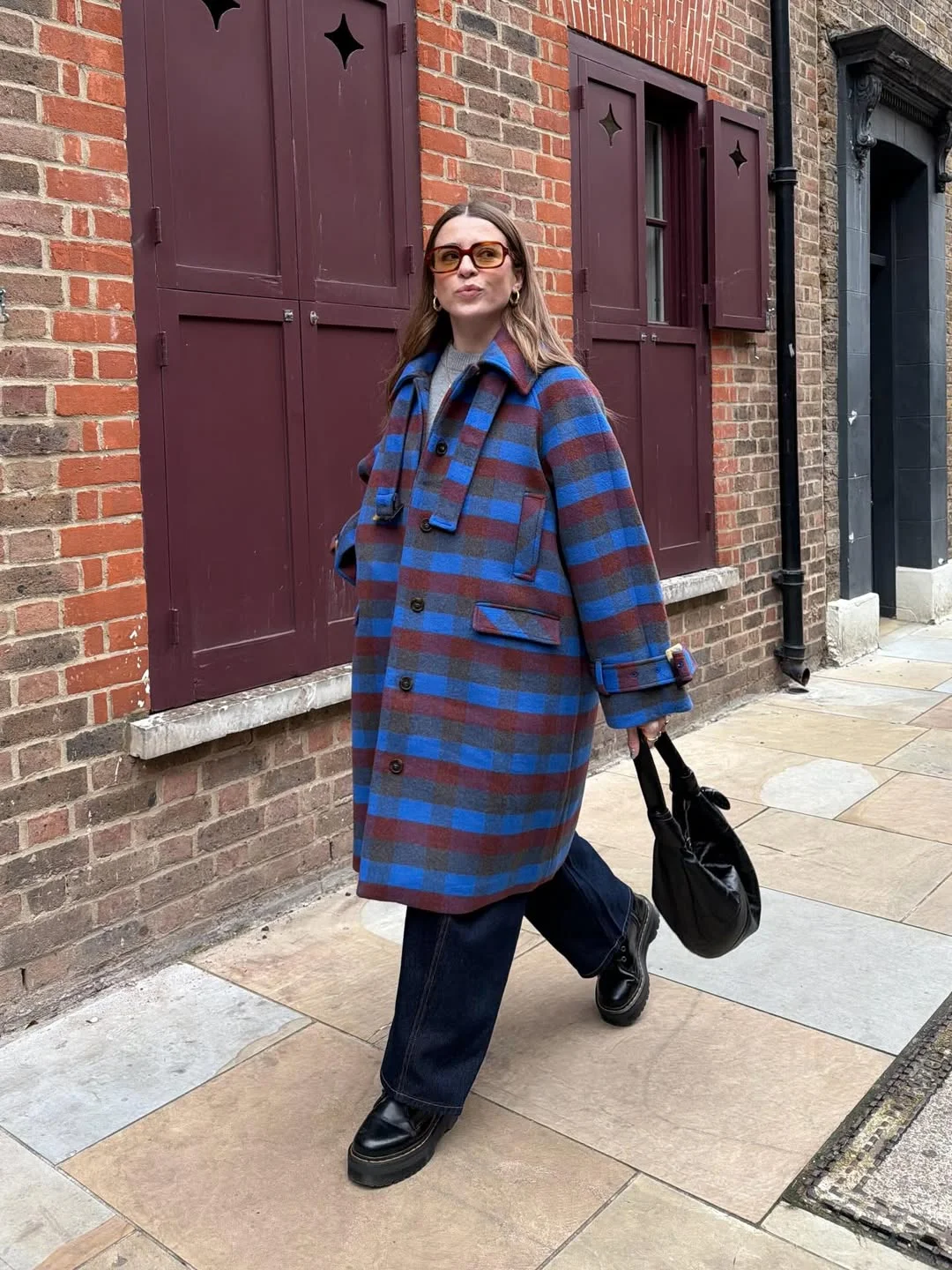 fall vest outfits for women 2026 A Bold Checked Coat for Layered Fall Dressing