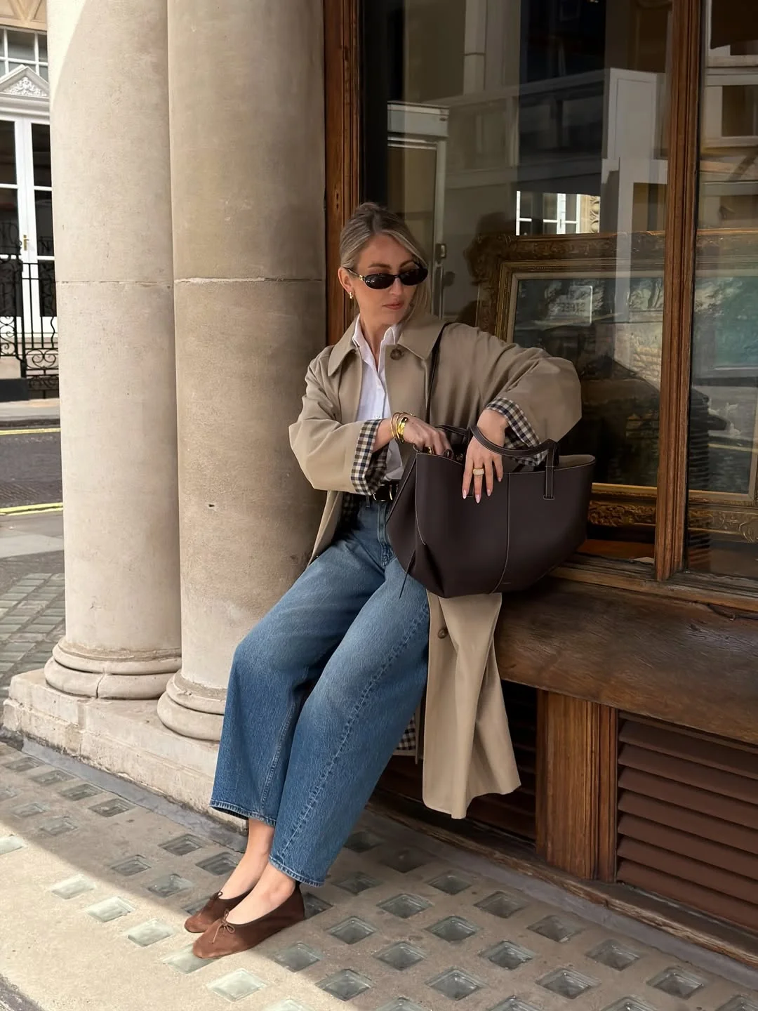 fall vest outfits for women 2026 A Beige Trench and Wide Jeans for Easy Vest Layering