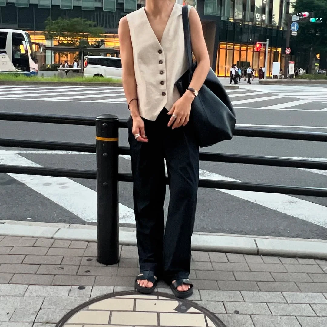 fall vest outfits for women 2026 Cream Linen Vest and Black Trousers for a Quietly Sharp Look
