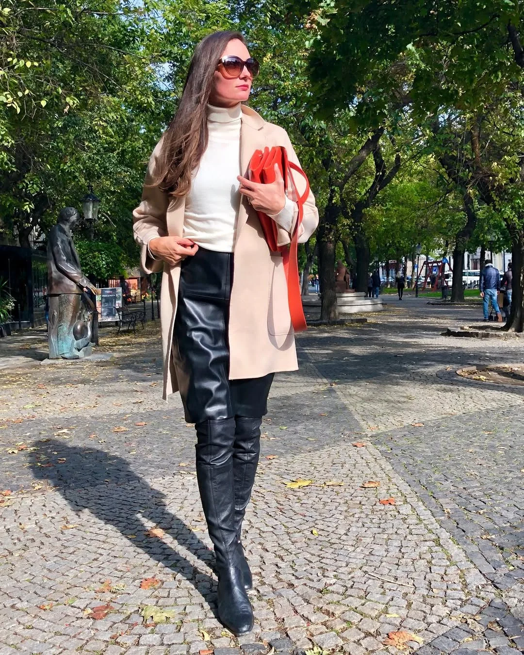 fall work outfits 2026 Cream Turtleneck and Leather Skirt With a Bold Red Clutch