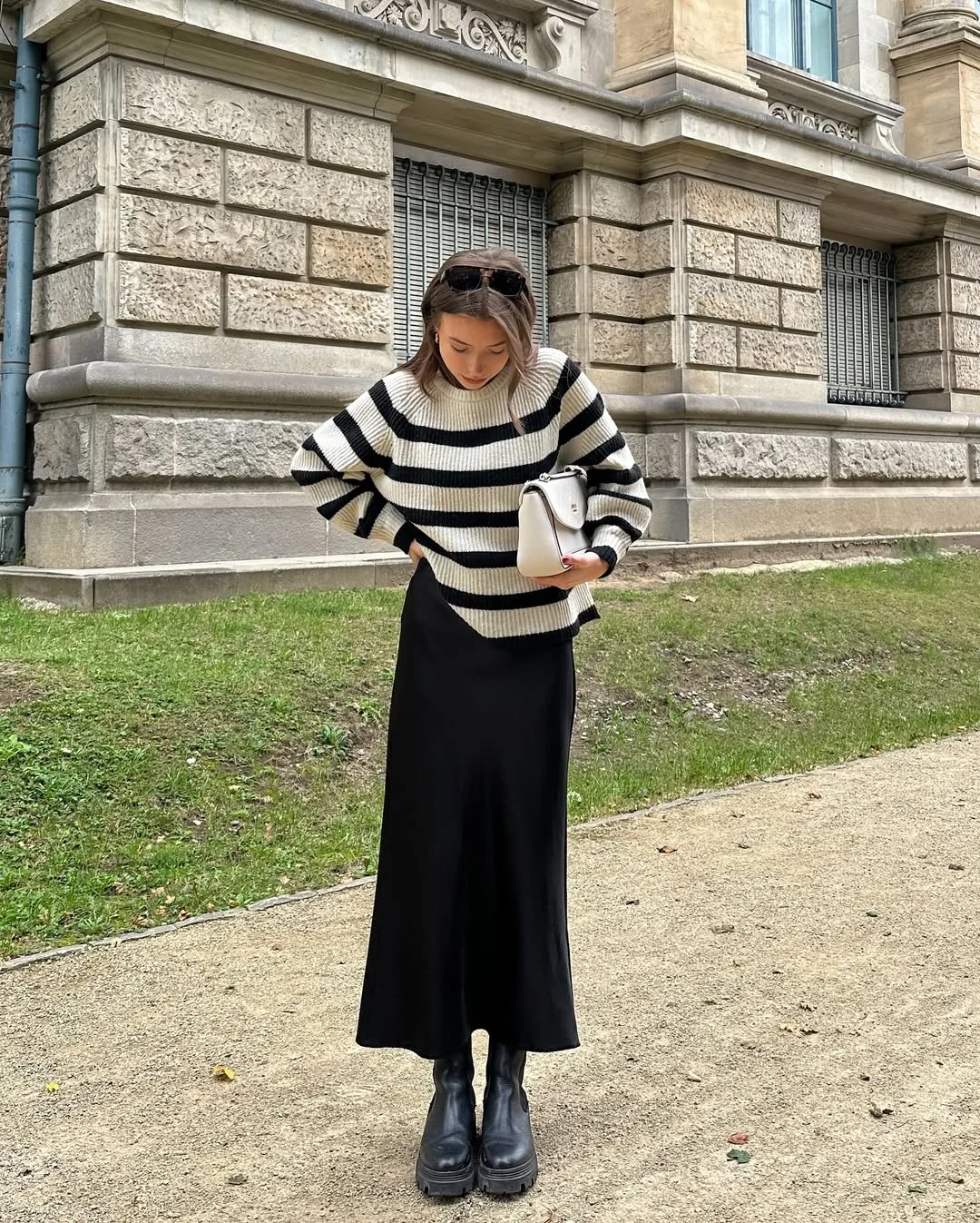fall work outfits 2026 Striped Sweater and Black Midi Skirt for Cozy Minimalism