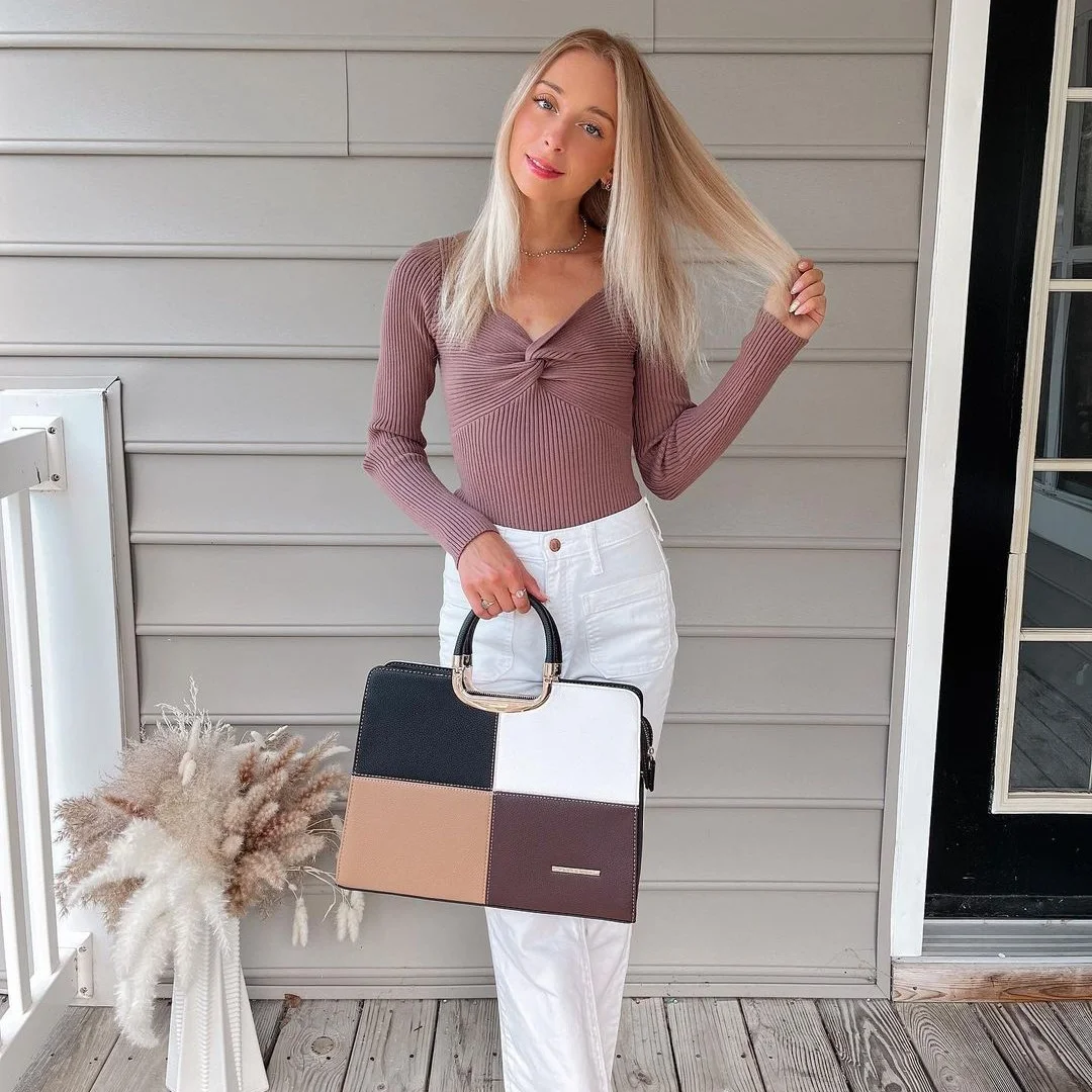 fall work outfits 2026 Mauve Knit Top With White Trousers and a Color-Block Bag