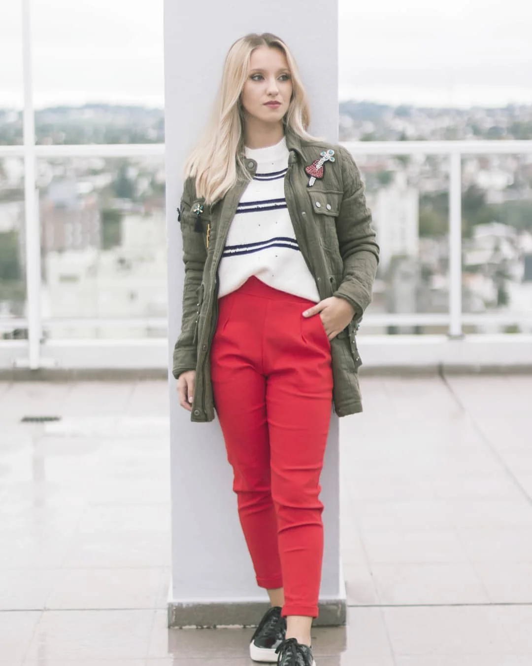fall work outfits 2026 Olive Jacket With Red Trousers and Striped Knit Energy