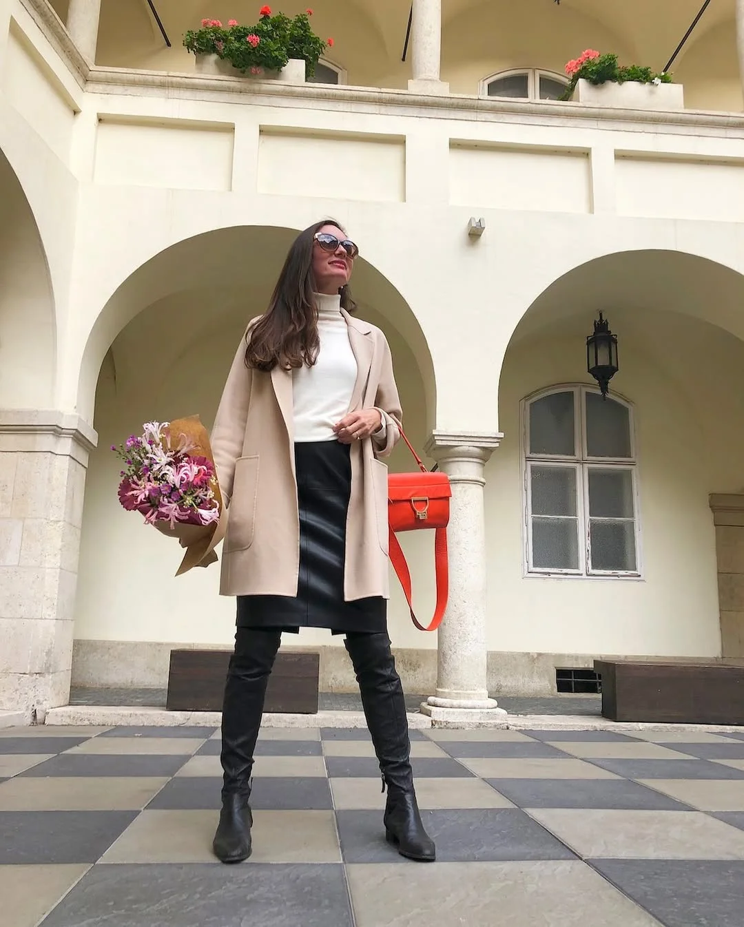 fall work outfits 2026 Black Leather Skirt With a Cream Turtleneck and Red Bag