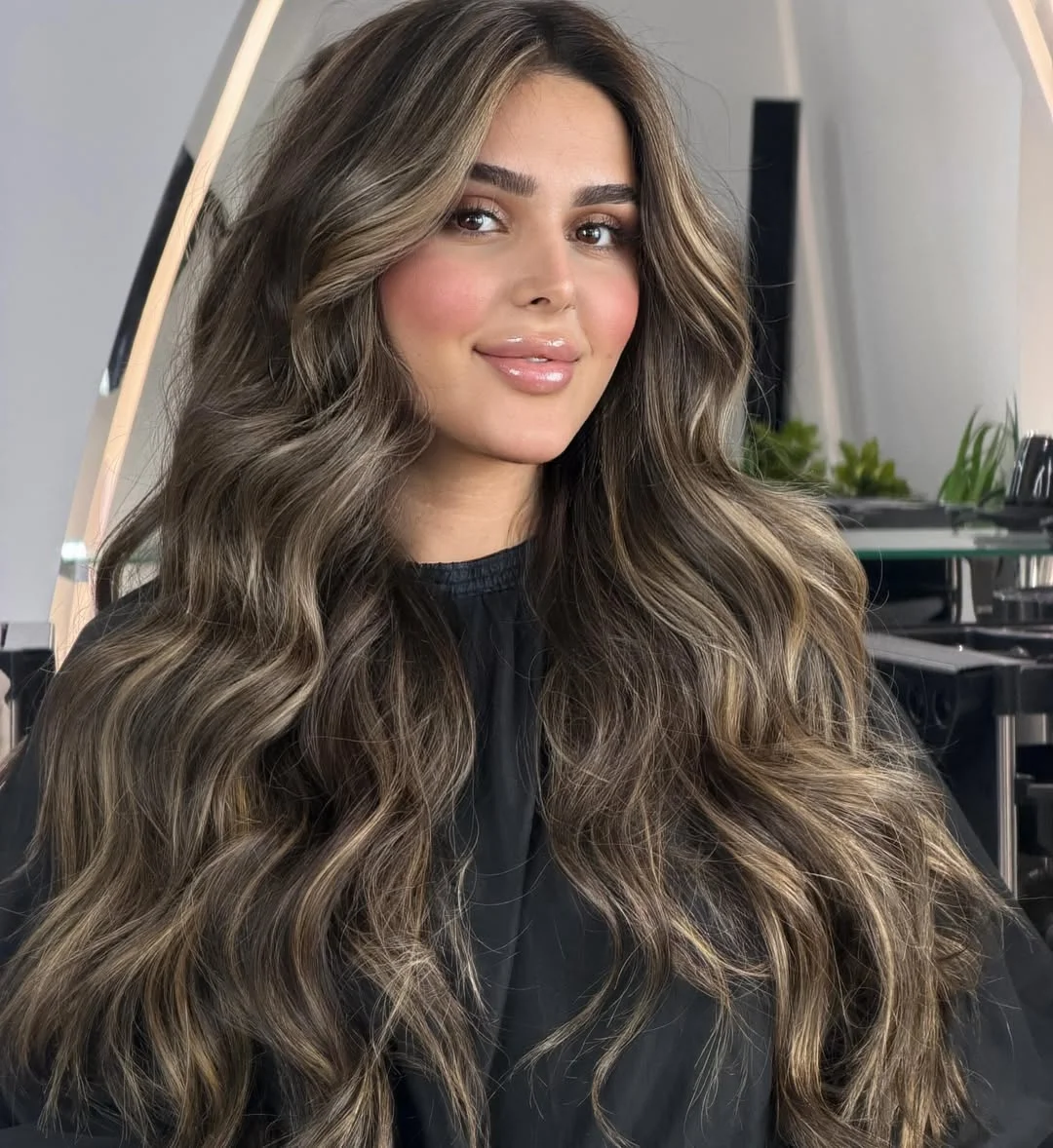 July hair colour ideas 2026 Smoky Brunette Waves With Champagne Ribbons