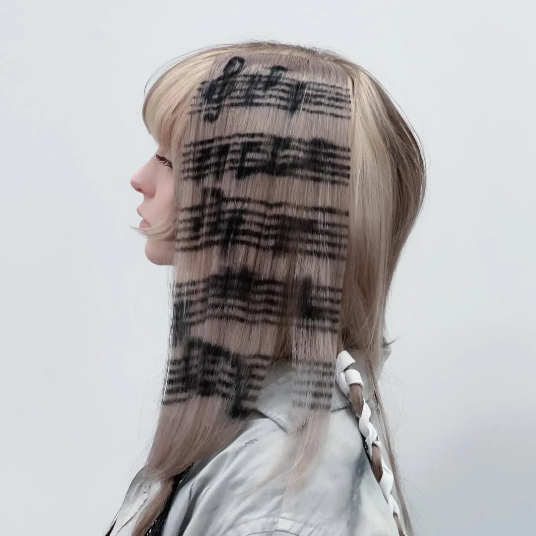 July hair colour ideas 2026 Sheet Music Blonde With Graphic Black Panels