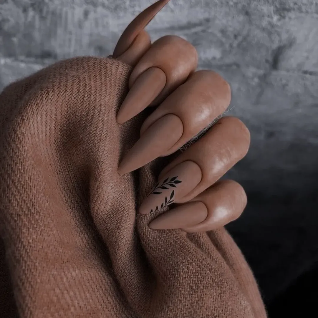 July nail colours ideas 2026 Matte Mocha Stiletto Nails With Black Leaf Art